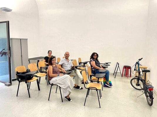 A Classroom With a Set of Chairs With a Bike