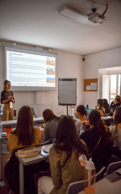A Woman Lecturer Teaching to a Group