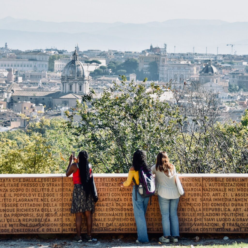 students overlooking Rome's skyline
